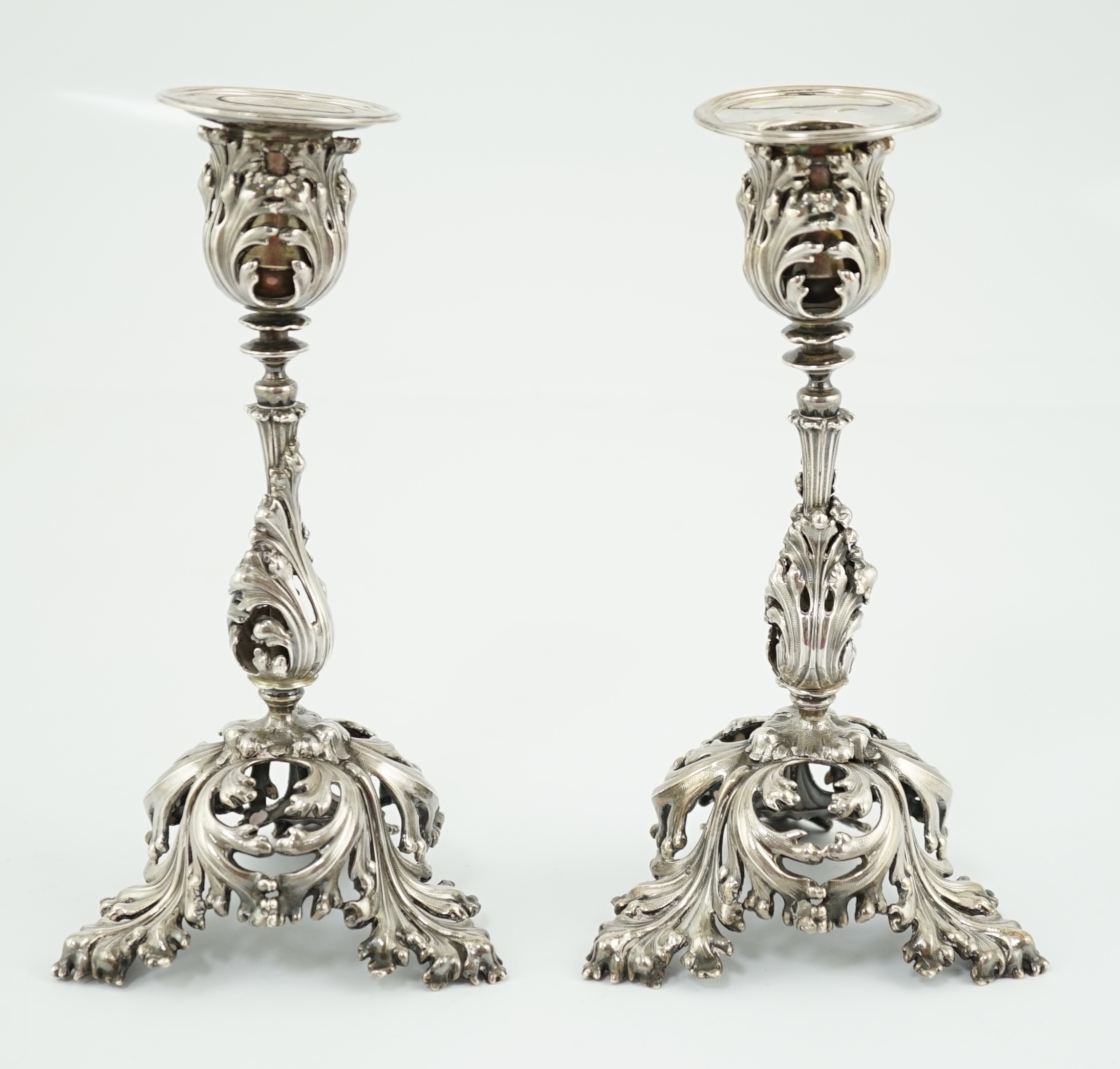 A pair of French pierced 950 standard silver candlesticks